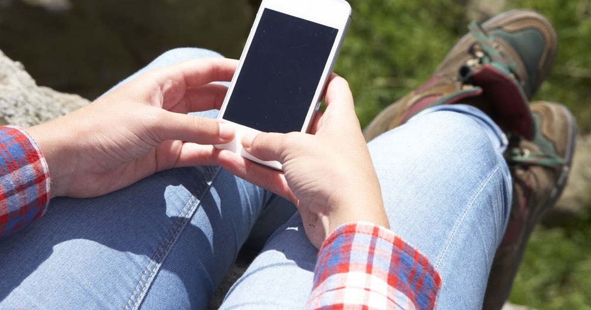 Teenage-Girl-Using-Mobile-Phone